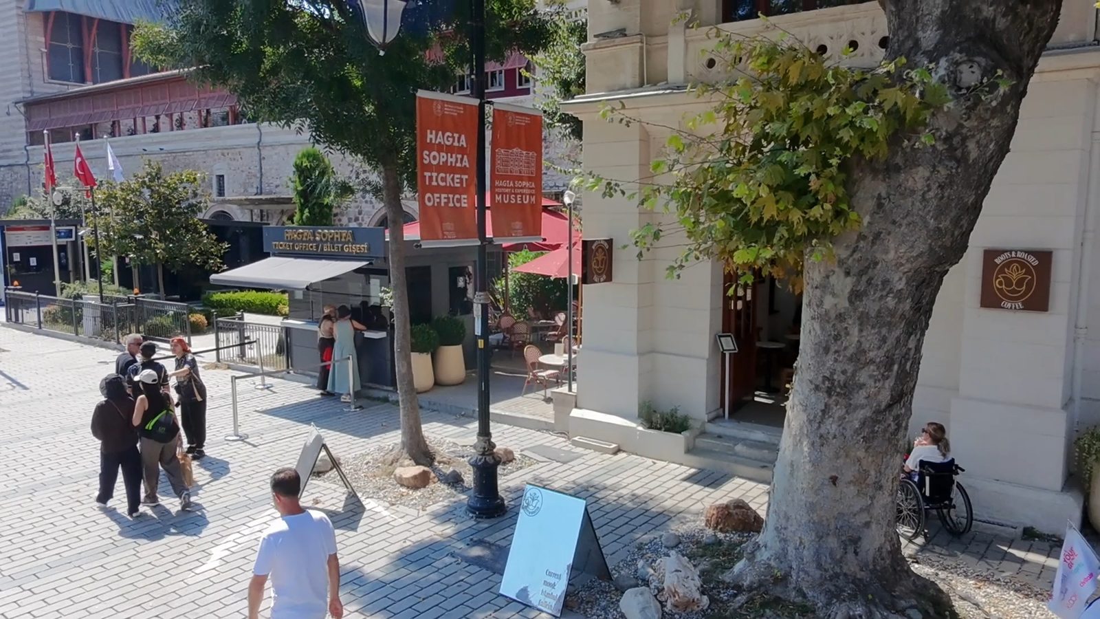 The Roots & Roasted sign on the building beside the Hagia Sophia ticket office